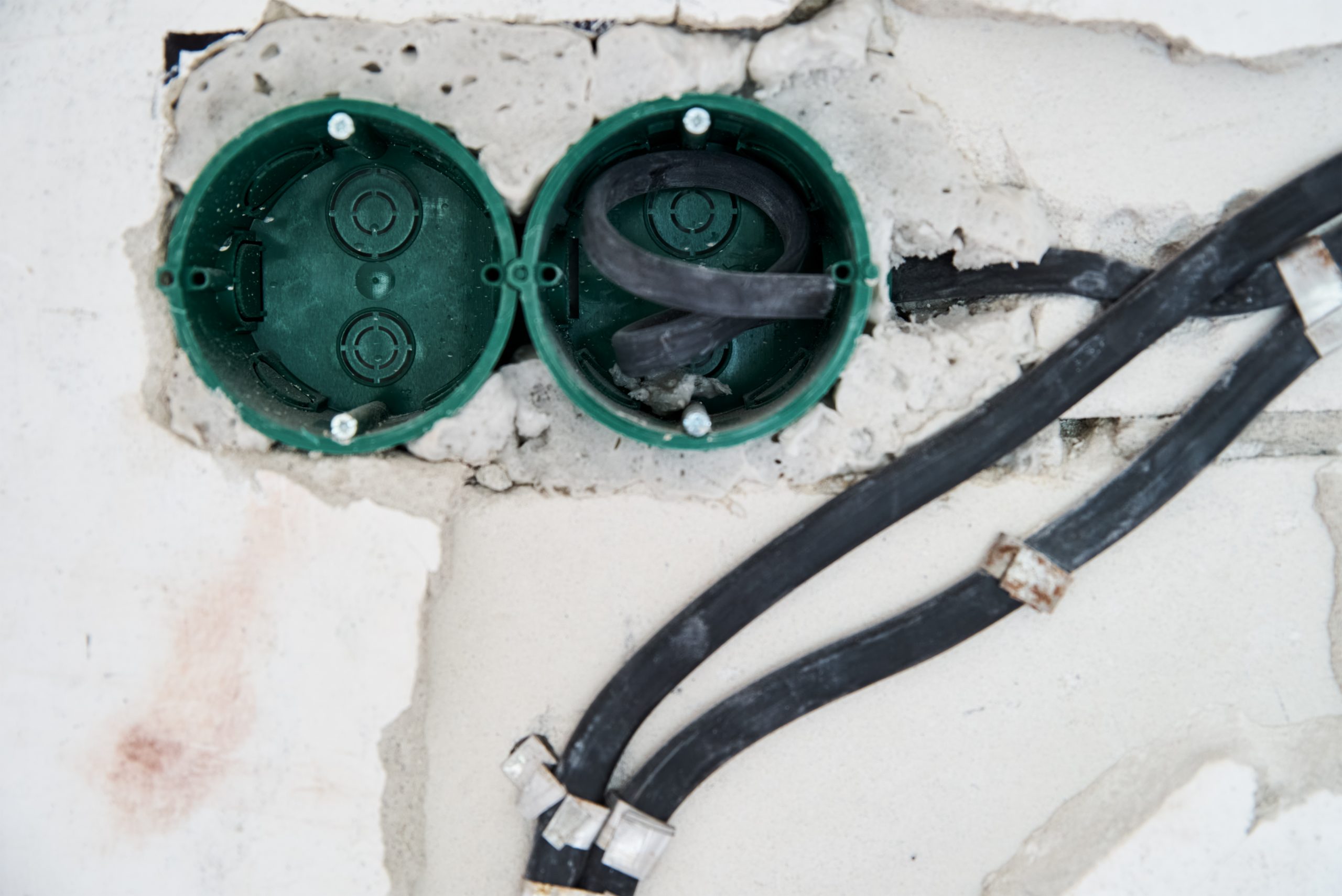 Socket for wiring in concrete wall. Renovation concept